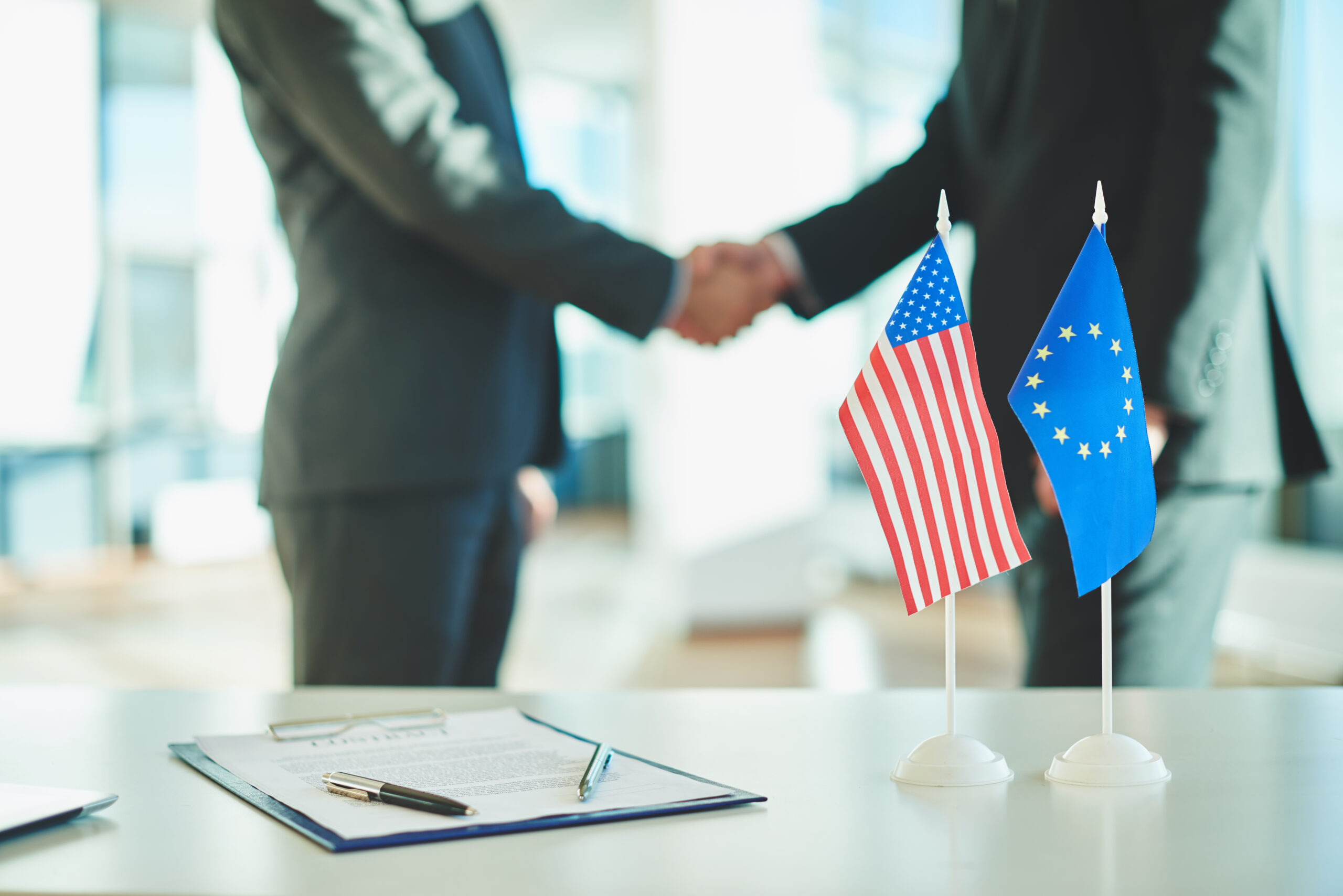 Close Up Two Businessmen Shaking Hands Scaled